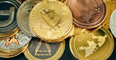 a pile of gold and silver bitcoins